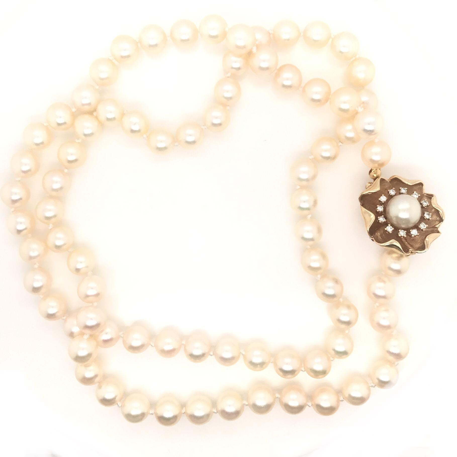 A Strand Of 8 MM Cultured Pearls With Diamond Clasp