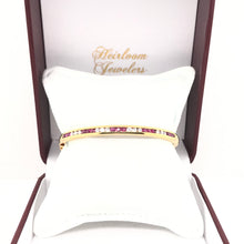 VINTAGE CHANNEL SET RUBY AND DIAMOND GOLD BANGLE
