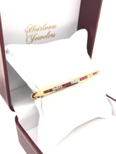 VINTAGE CHANNEL SET RUBY AND DIAMOND GOLD BANGLE