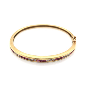 VINTAGE CHANNEL SET RUBY AND DIAMOND GOLD BANGLE