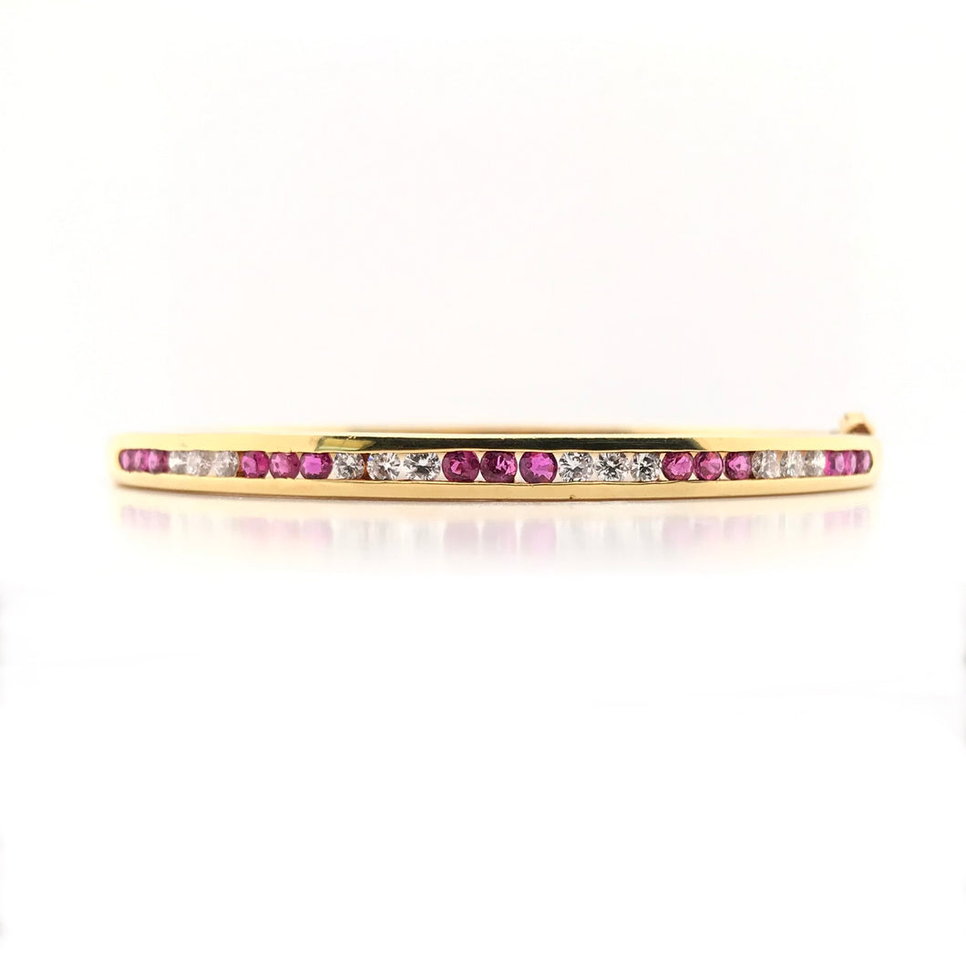 VINTAGE CHANNEL SET RUBY AND DIAMOND GOLD BANGLE