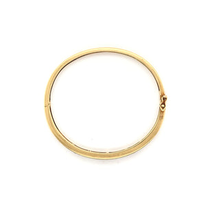 VINTAGE CHANNEL SET RUBY AND DIAMOND GOLD BANGLE